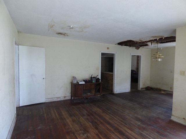 empty room with dark wood-type flooring