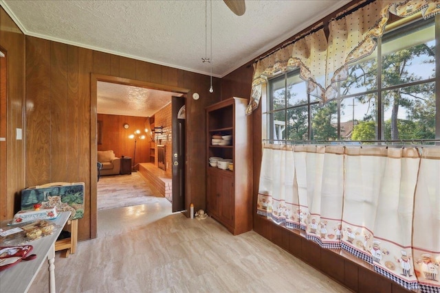 7760 Laurie Ln, Lumberton, TX 77657 - hallway featuring wooden walls and a textured ceiling