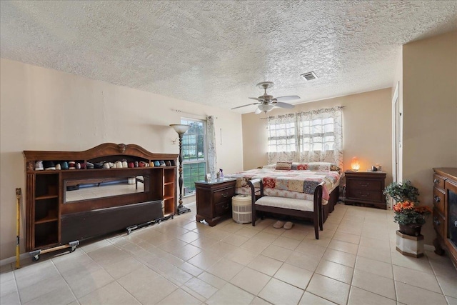 7760 Laurie Ln, Lumberton, TX 77657 - tiled bedroom featuring ceiling fan and a textured ceiling
