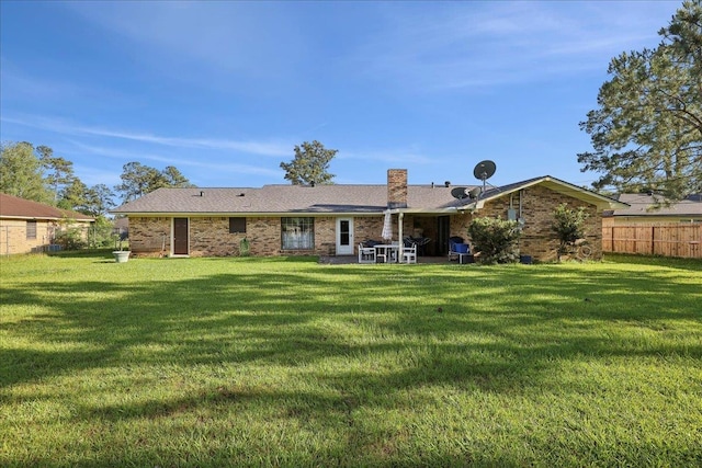 7760 Laurie Ln, Lumberton, TX 77657 - back of property with brick siding and a patio area