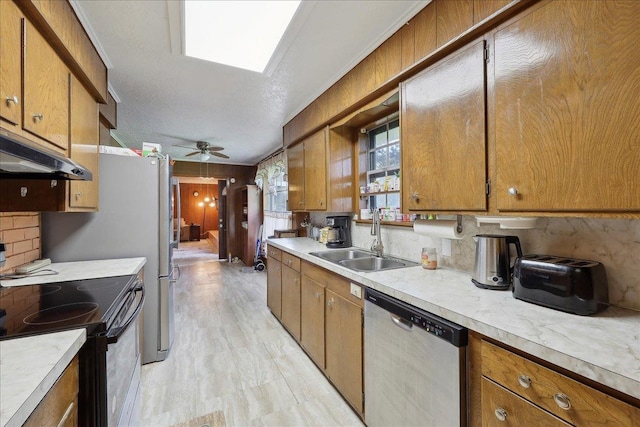 7760 Laurie Ln, Lumberton, TX 77657 - kitchen with range with electric stovetop, dishwasher, a sink, and brown cabinetry