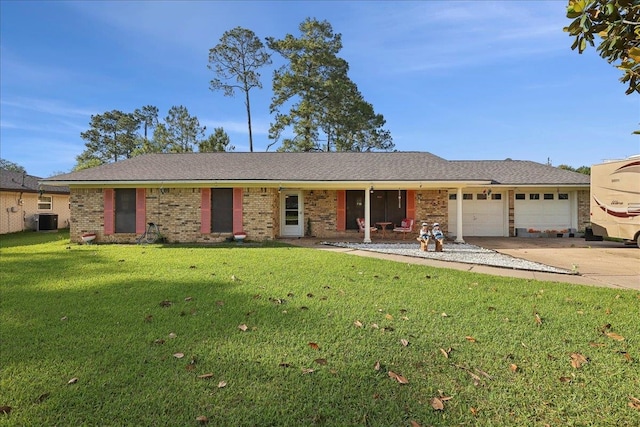7760 Laurie Ln, Lumberton, TX 77657 - single story home with driveway, an attached garage, central AC, a front yard, and brick siding