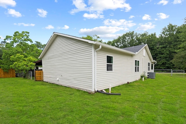 view of side of home with central AC unit