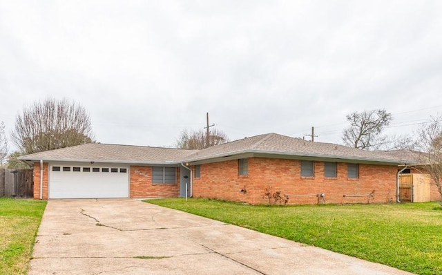 ranch-style home with a front lawn and a garage