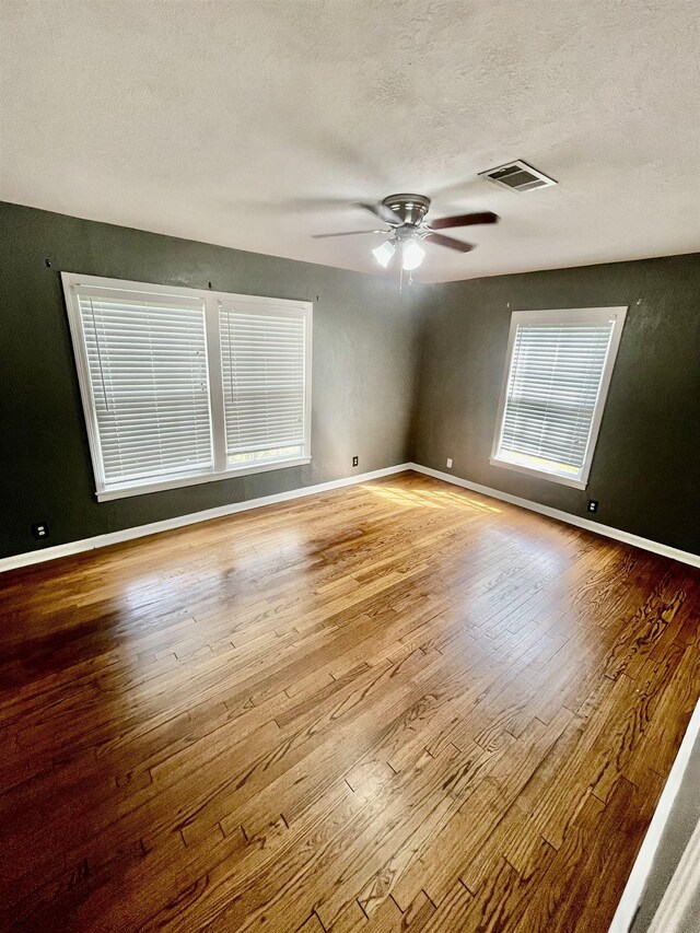 back of property with a lawn and a wooden deck