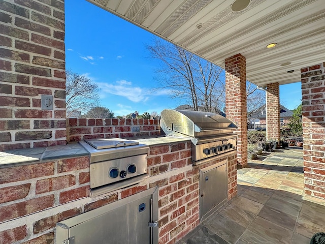 view of patio / terrace featuring a grill and exterior kitchen