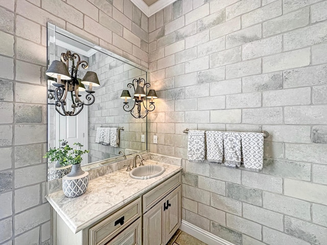 bathroom with vanity and crown molding