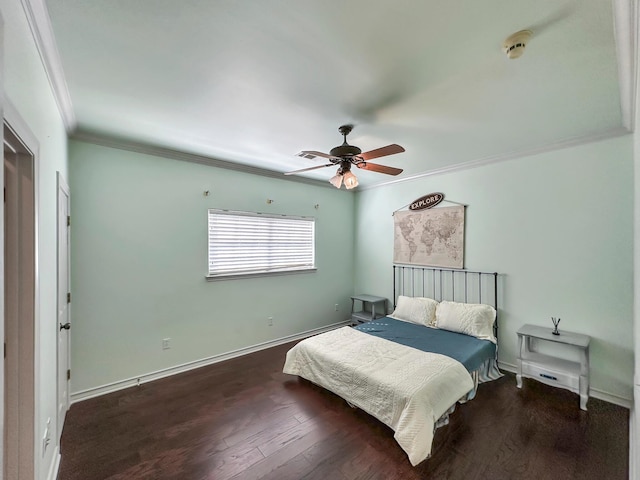 bedroom featuring crown molding, dark hardwood / wood-style flooring, and ceiling fan