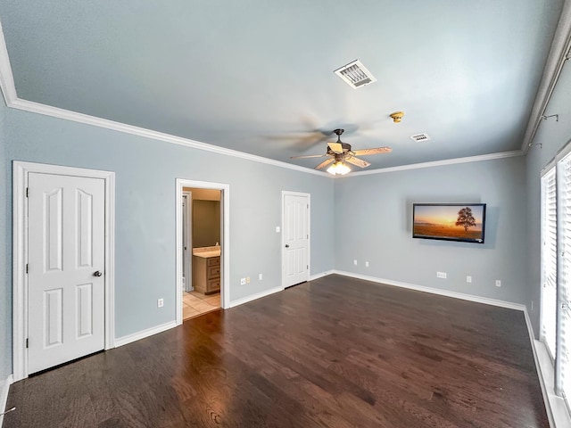 unfurnished bedroom with dark hardwood / wood-style floors, ceiling fan, ornamental molding, and connected bathroom