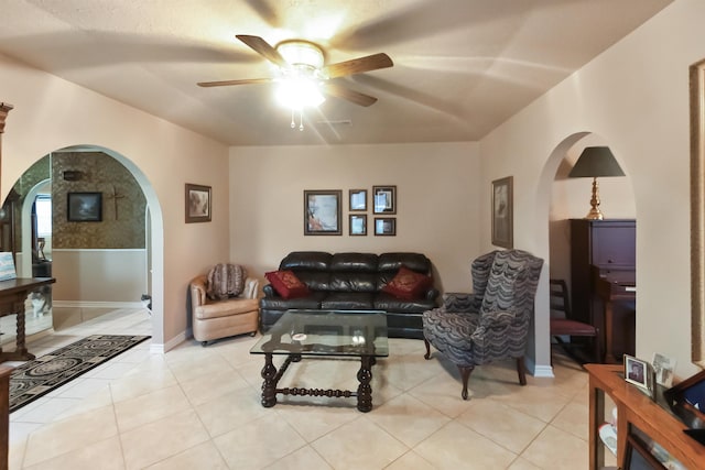 living room featuring ceiling fan and light tile patterned floors