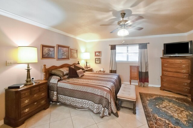 tiled bedroom with ceiling fan and crown molding