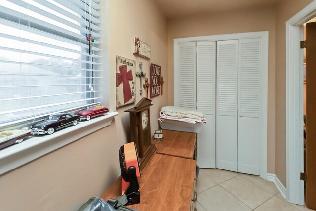 interior space with light tile patterned floors