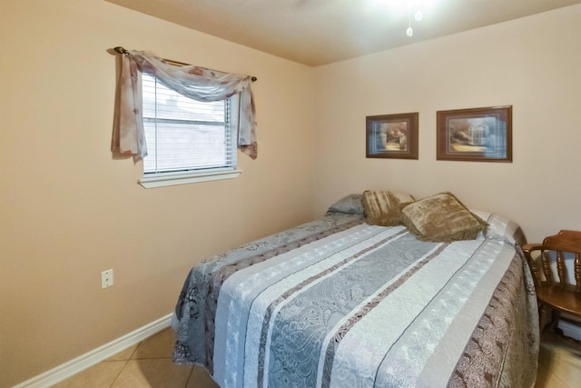 bedroom featuring light tile patterned flooring