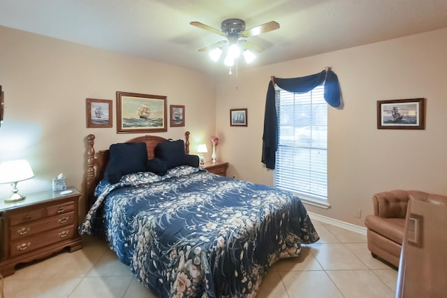 tiled bedroom featuring ceiling fan