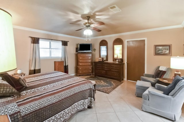 tiled bedroom with ceiling fan and crown molding