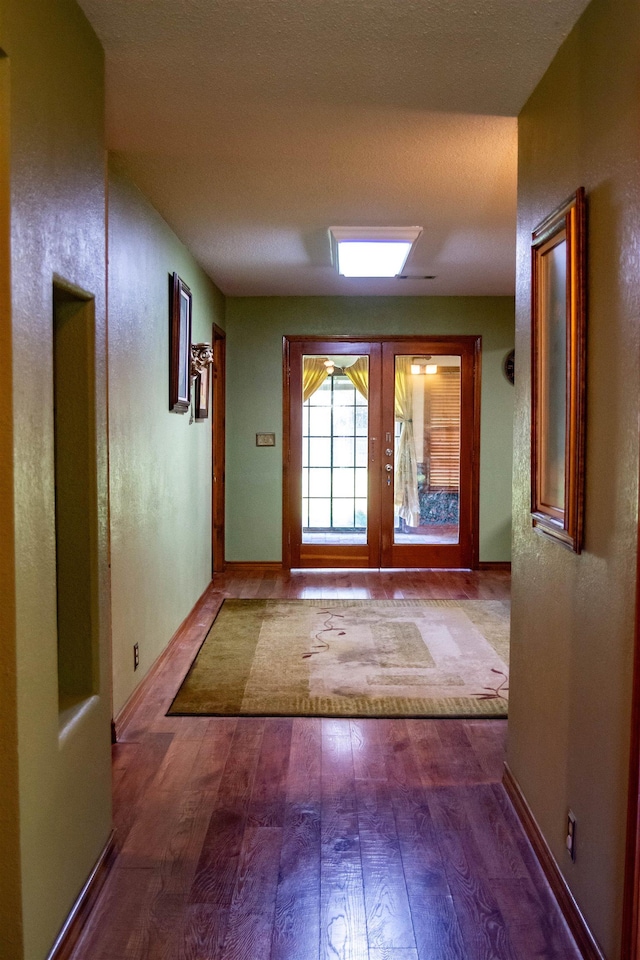 entryway featuring french doors and light hardwood / wood-style floors