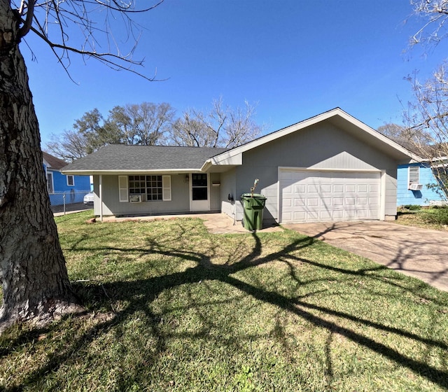 ranch-style house with a garage and a front lawn