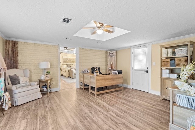 office space featuring ceiling fan, visible vents, baseboards, a textured ceiling, and wood finished floors