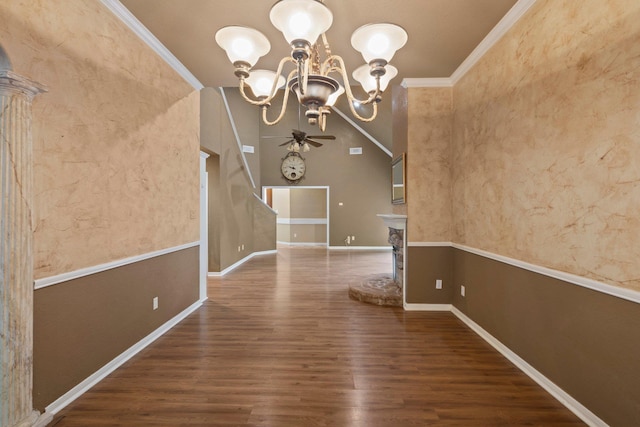 unfurnished dining area featuring ornamental molding, wood finished floors, a chandelier, and baseboards