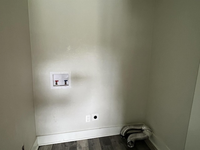 clothes washing area with hookup for an electric dryer, hookup for a washing machine, and dark wood-type flooring