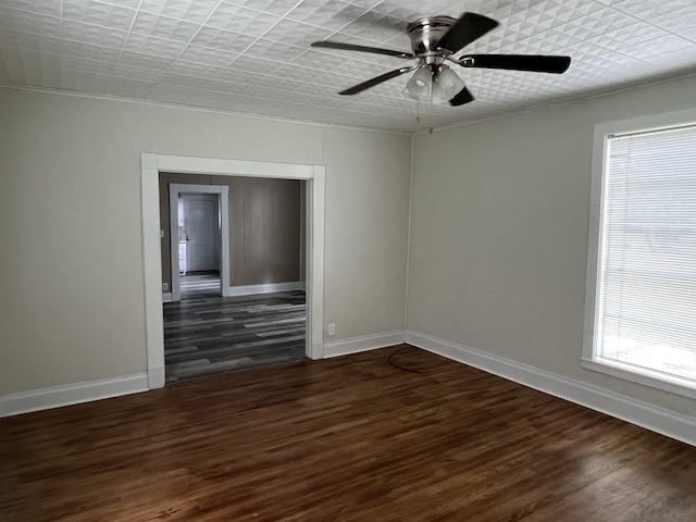 unfurnished room featuring ceiling fan and dark hardwood / wood-style floors