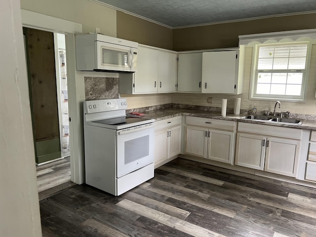 kitchen with white cabinetry, white appliances, and sink