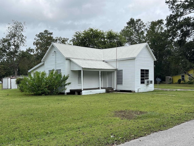 view of property exterior featuring covered porch and a yard