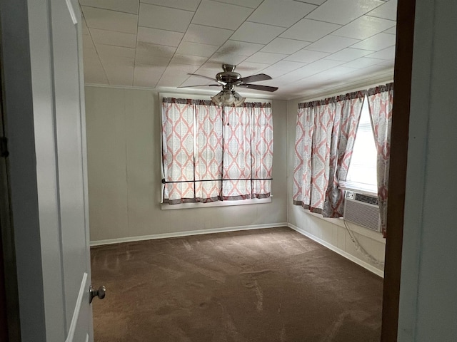 unfurnished room with dark colored carpet and ceiling fan