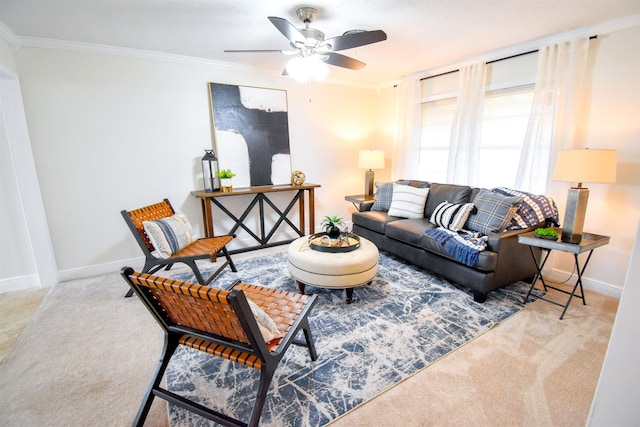 carpeted living room featuring ceiling fan and ornamental molding