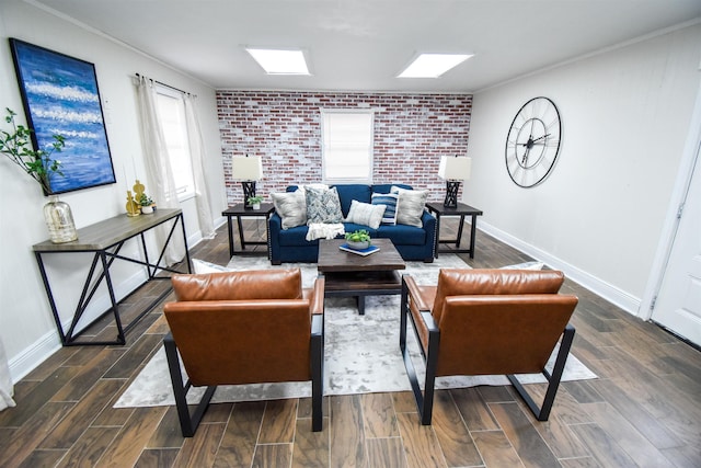 living room with a skylight, brick wall, and crown molding