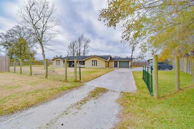 ranch-style home with a front yard and a garage