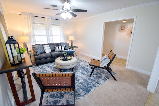 living room featuring ceiling fan, ornamental molding, and light carpet