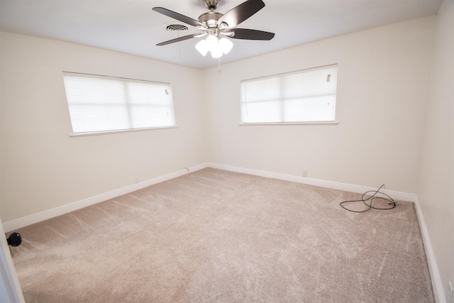 carpeted empty room with ceiling fan