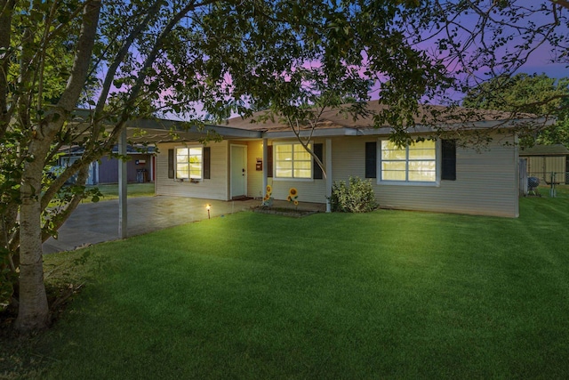 ranch-style house with a yard