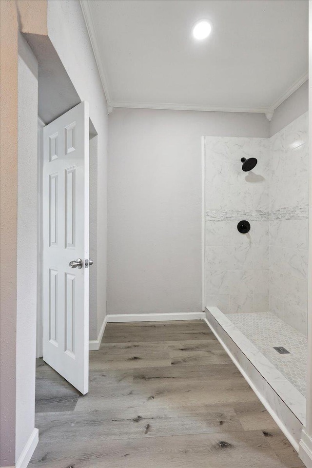 2033 Broadway St, Beaumont, TX 77702 - bathroom with ornamental molding, tiled shower, wood finished floors, baseboards, and recessed lighting