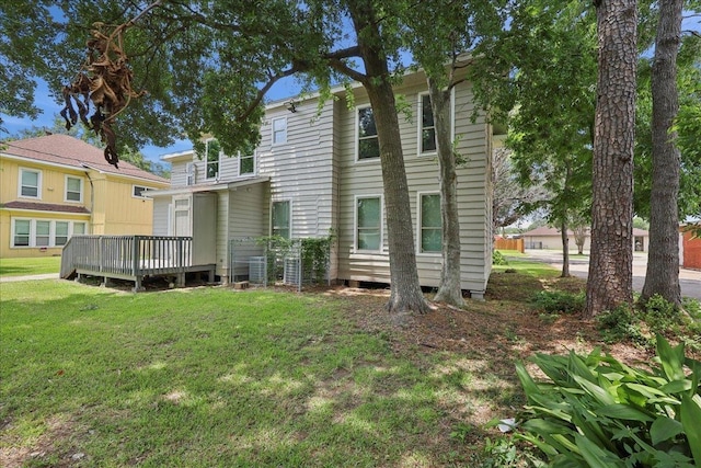 2033 Broadway St, Beaumont, TX 77702 - back of house featuring a yard and a wooden deck