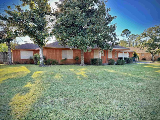 single story home featuring a front yard