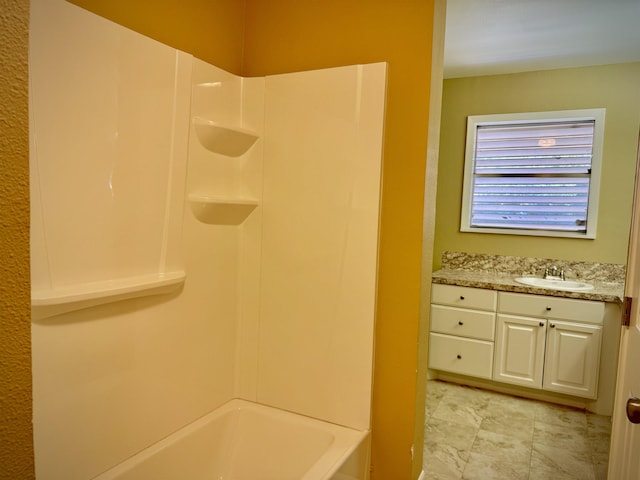 bathroom with shower / bathing tub combination and vanity