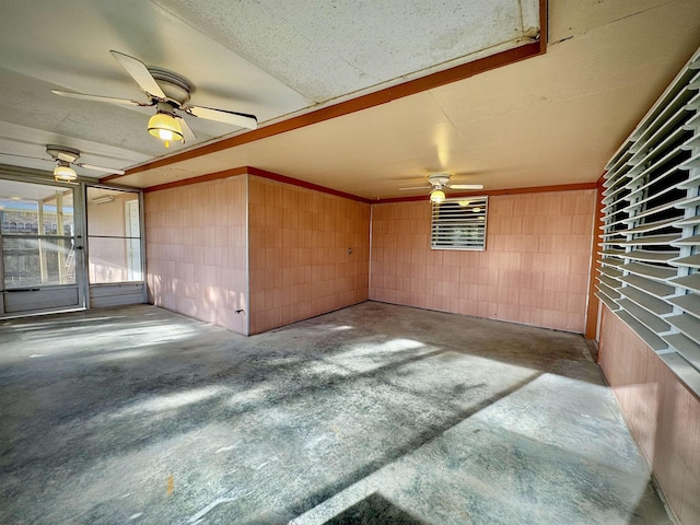 interior space with ceiling fan