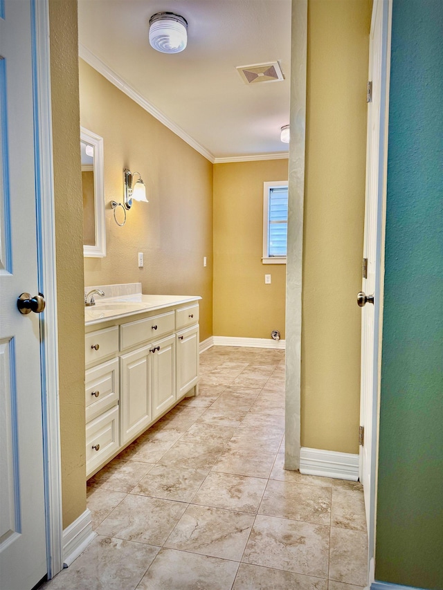 bathroom featuring crown molding and vanity