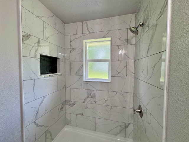 13595 Rolling Hills Dr, Beaumont, TX 77713 - bathroom with a tile shower and a textured wall