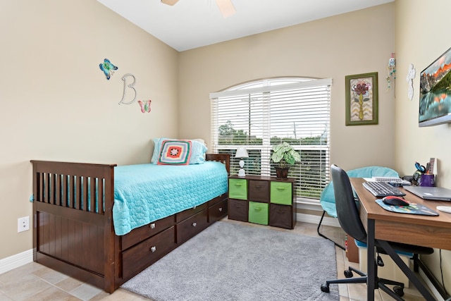 tiled bedroom featuring ceiling fan