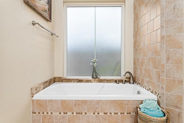 bathroom with tiled bath