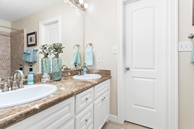 bathroom featuring tile patterned floors and vanity