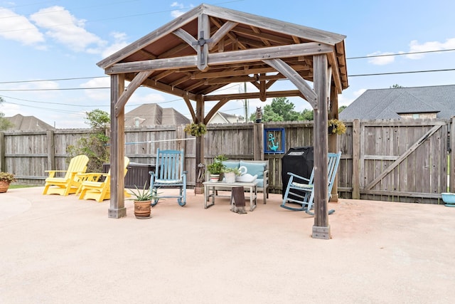 view of patio featuring outdoor lounge area and a gazebo