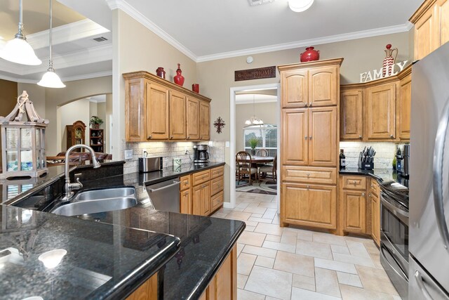 kitchen featuring pendant lighting, an inviting chandelier, crown molding, sink, and appliances with stainless steel finishes