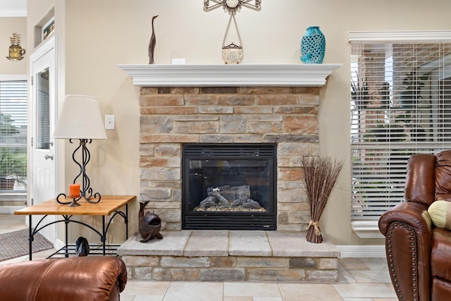 interior details featuring a stone fireplace