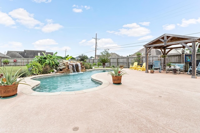 view of swimming pool with pool water feature, a gazebo, and a patio