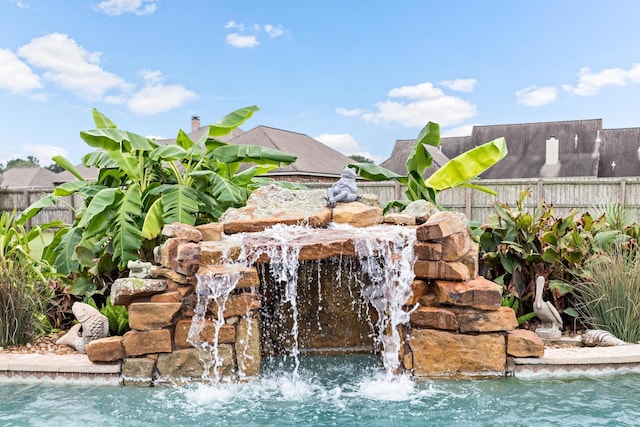 view of pool featuring pool water feature