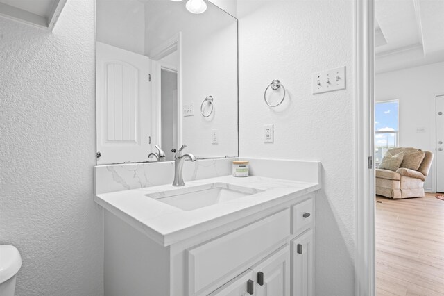 981 S S Gtwy, Crystal Beach, TX 77650 - bathroom with a textured wall, wood finished floors, and vanity
